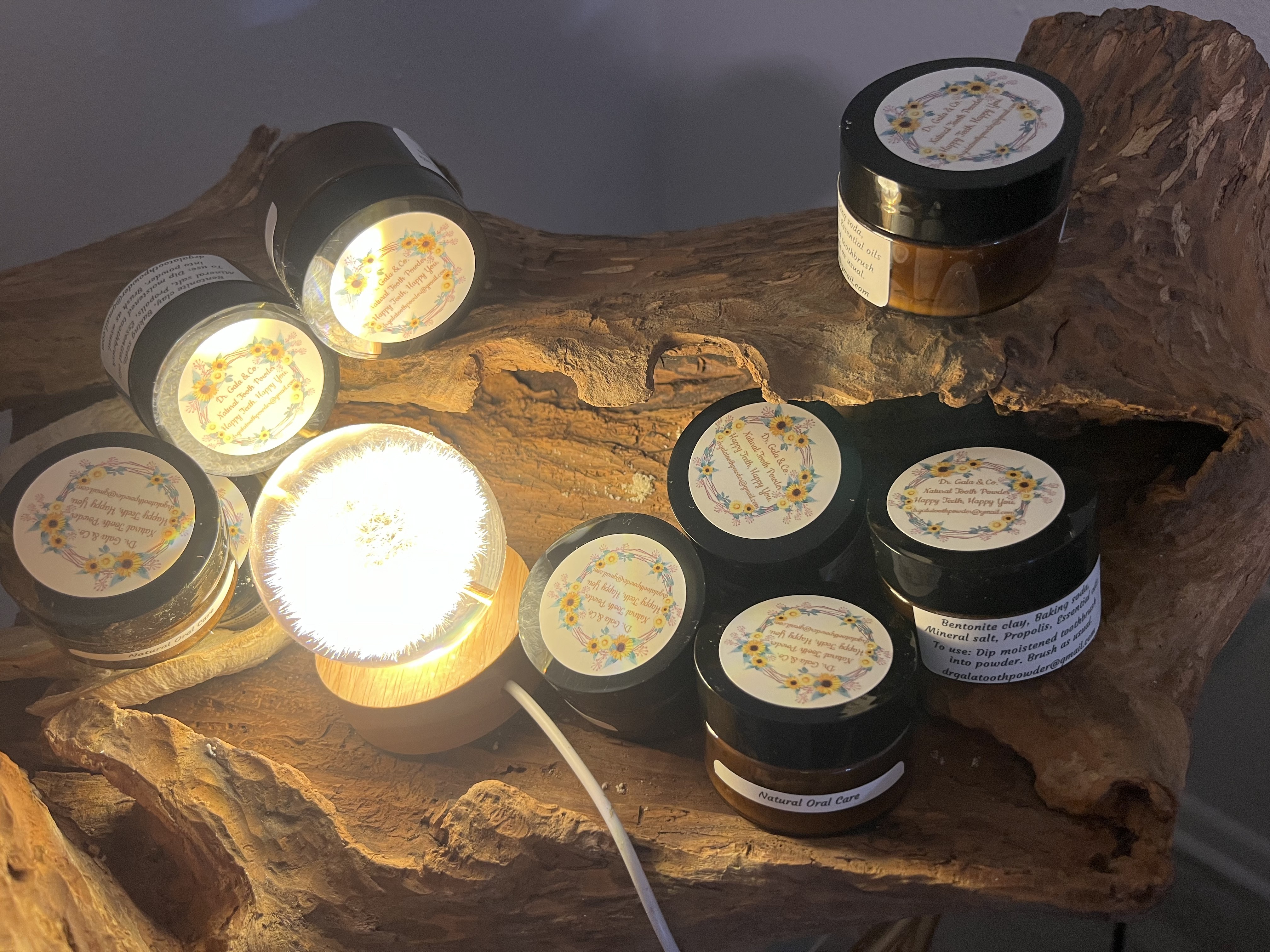 Powder Dent Natural Tooth Powder jars on carved wood